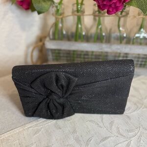 Style & Co black shimmery evening clutch bag with a bow detail. 8”x‎ 4.5” x 1.5”